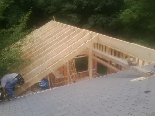 Framing a new roof addition that ties into an existing shingle roof in Groton